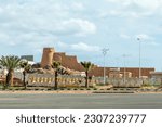 Small photo of Arabian ruined watch tower and wall on the streets of Hail, Saudi Arabia
