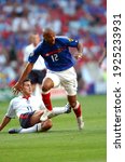 Small photo of LISBON, PORTUGAL - JUNE 13, 2004: Thierry Henry and Frank Lampard in action during the UEFA Euro 2004 - France v England at Estadio da Luz.