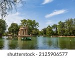 Small photo of Rome, Italy, June 27, 2014: Visitors of the gardens of the Villa Borghese in Rome, Italy, navigate rowboats near the Temple of Aesculapius during a summer day.