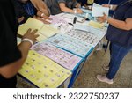 Small photo of Guatemala, Guatemala city. June 25, 2023. The Vote Receiving Board prepares the ballots to be delivered to voters at a polling station on general election day in Guatemala.