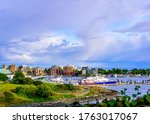 Boats, buildings and cloud formations in the scenic inner harbour of Victoria, Vancouver Island, British Columbia, Canada
