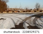 Car tire tracks on a snowy road