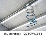 Flexible metal conduit (FMC) of ceiling electrical wiring in construction site background