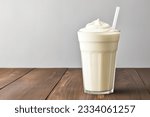 Vanilla cocktail with whipped cream in a tall glass on wooden table. Background with copy space, 3d rendering