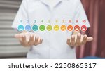 Small photo of Doctor touching of pain measurement scale colorful icon virtual screen interface, emotions from happy blue to red crying, medical technology and futuristic concept.