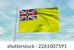 Small photo of Seamless loop animation of the Niue flag on a blue sky background. 3D Illustration. High quality 3d illustration