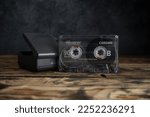 Small photo of MIEKINIA, POLAND - AUGUST 9, 2022: Memorex compact cassette tape and old Walkman Sony TCM 353V Cassette Corder. Retro portable music player, vintage audio device.