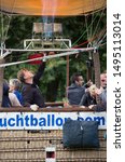 Small photo of Waddinxveen, Netherlands - SEPTEMBER 2, 2019: Men fillip hot air balloon with fire. Hot air balloons are released in the Gouwebos in Waddinxveen, The Netherlands.