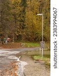 Small photo of Bohinj, Slovenia, november 3rd 2023 Flooded road with forest in background on lake Bohinj during the flood event in November 2023, when the water was about 2m above normal level