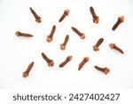 Small photo of dry cloves on white background. Dried Organic Clove Buds top view. Dry spice cloves isolated on white background with clipping path. Top view. Flat lay. Syzygium aromaticum.