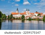 TELC (TELČ), CZECH REPUBLIC (CZECHIA) – SEPTEMBER 24, 2020: Beautiful view of churches from the pond Ulický rybník, Vysocina Region (Kraj Vysočina)