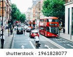 Small photo of London UK - June 23, 2017,bicycles, cars and double-decker buses that shuttle back and forth during off work time on Bloomsbury way near Bloomsbury Square Garden