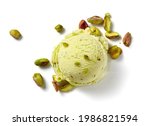 Scoop of pistachio ice cream with pistachio nuts on white background. Top view of ice cream isolated for package design of pistachio ice cream.