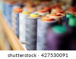 Colorful thread spools used in fabric and textile industry