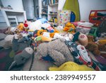 Small photo of Toys laying on the floor in a kids room. Mess at home. Clining kids toys concept.