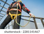 Small photo of Construction workers wearing safety harnesses and harnesses work at heights in safety body structures. working at height Worker fall protection with hook for safety harness
