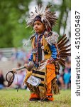 Small photo of Kahnawake, Quebec, Canada - July 10, 2016 : Pow wow toddler boy dancer taking part in Kahnawake 26th Annual Echoes Of A Proud Nation Pow Wow in Kahnawake reserve. Tiny tots category.