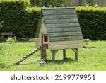 Small photo of A Moveable Wooden Hen House in a Garden Orchard.