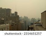 Smoke from Canadian forest fires arrives in New York City pollutng the air, setting off health alerts and giving the sky an eerie yellow tone