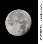 Small photo of A full moon in the dark sky take with a 400mm sony lens.