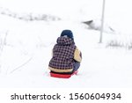 Boy is riding with a snow slide