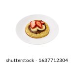 Small photo of Food photography of a toasted crumpet with nutella, strawberries and banana on a white plate on a white background