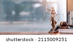 Small photo of Legal and law concept. Statue of Lady Justice with scales of justice and wooden judge gavel on wooden table. Panoramic image statue of lady justice.