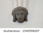 Small photo of Darjiu Szekelyderzs Romania. 19.sep.2019. He stretches out his tongue. Sculpture of a scoffer head as a corbel, supporting the arch in the UNESCO World Heritage Listed Unitarian Fortified Church.