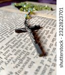 Small photo of Rome, Ro, Italy 06 06 2023: god crucifix on a holy bible book background. biblia with siritual cross crucifix. jesus symbol crucifix.