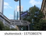 Small photo of Frankfurt AM MAIN, GERMANY - JULY 24, 2016 :The guideboard in the middle of the CBD street of Frankfurt am Main