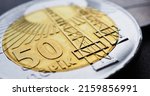 Small photo of Azerbaijani coin of 50 qepiks close-up. Money of Azerbaijan. News about economy or finance. Loan and credit. Savings and interest. Azeri qepik qÉ™pik coins. Horizontal stories. Macro