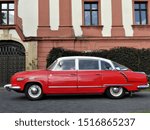 Small photo of Kunin, Czech Republic - 09-28-2019: 9th St. Wenceslas Ride ("Svatovaclavska vyjizdka". Red Tatra 603 with a white roof at the car exhibition before the start in the park of Chateau Kunin.