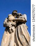 Small photo of Dobroslavice, Czechia - Feb 16, 2019: Statue of sad family. Soldier, recruit, conscript and enlistee from WW1 is going to war. Goodbye and farewell with wife and child. Military memorial monument
