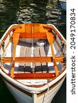 Wooden Rowboat At Dock With...