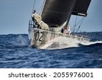 Small photo of Mahon, Spain - October 30, 2021: One of the Platoon crew members prepares to hoist the spinnaker at the Menorca Sailing Week.