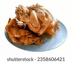 Small photo of Isolated strewed pork leg on white background.