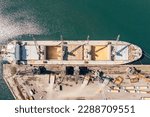 Small photo of Aerial Top down view Black Sea port Loading of dry cargo ship with ukranian grain by cranes. Maritime grain Import and export concept