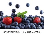 fresh blueberries and strawberries on a white background, fruits, moment