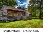 Small photo of Natchez Trace Parkway, Tennessee, USA: June 17, 2020 A wood building on the site and ruins of the Grinder house where Merriwether Lewis died on October 11, 1809