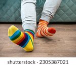Small photo of Strange Socks Day. Lonely Sock Day. The social problem of bullying. Strange socks as a symbol of Down syndrome