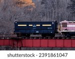 Small photo of Hokkaido, Japan - 11／5／2023: A coal scuttle train displayed on an abandoned railway bridge in the evening.