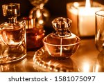 Perfumery, cosmetics branding and luxe concept - Perfume bottle and vintage fragrance on glamour vanity table at night, pearls jewellery and eau de parfum as holiday gift, luxury beauty brand present