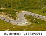 Bikers going down the beautiful serpentines of the  Transalpina road in Romania - the highest mountain road in the Carpathians located in the Parang Mountains