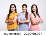 Small photo of Three indian women giving expression together on white background.