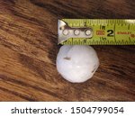 Ping-pong to golf ball sized hail with measuring tape to verify size, taken from a severe weather hail storm in North Texas.  April 2018