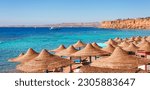 Small photo of Sunny resort beach on the Red Sea in Sharm el Sheikh, Sinai, Egypt