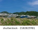 Small photo of Obama City, Fukui, Japan – July, 22, 2021 – Boat cemetery in Obama City, seaside ground.