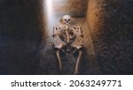 Small photo of Skeleton in tomb. The skeleton of the princess. Archaeological excavations and finds, a detail of ancient research, prehistory. Bones of a skeleton in a human burial
