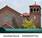 Small photo of DUBUQUE, IOWA, October 28, 2021–DUBUQUE, IOWA, October 28, 2021–Landscape photo of beautiful old historic building with red tile roof and bell tower taken on overcast day.