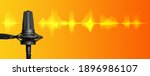 Small photo of Professional studio microphone on orange and yellow background with signal waveform and copy space, broadcasting, recording studio or podcast banner